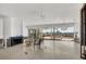 Expansive living room with terrazzo floor and an airy ambiance, perfect for entertaining and enjoying waterfront views at 400 Anchor Row, Placida, FL 33946
