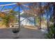 Exterior patio with picnic table under pergola with foliage surrounding the area at 400 Anchor Row, Placida, FL 33946
