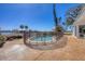 Backyard view of fenced in kidney bean shaped pool surrounded by concrete patio at 400 Anchor Row, Placida, FL 33946