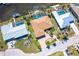 Aerial view of homes with screened-in pools and waterfront access on a sunny day at 471 Capri Isles Ct, Punta Gorda, FL 33950