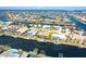 Stunning aerial view of waterfront homes along canals with boat docks and ocean access in a desirable neighborhood at 471 Capri Isles Ct, Punta Gorda, FL 33950