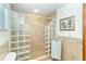 Beautifully tiled walk-in shower featuring glass block and designer accents at 471 Capri Isles Ct, Punta Gorda, FL 33950