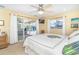 Bedroom with pool views from the lanai; features soft decor and neutral color palette at 471 Capri Isles Ct, Punta Gorda, FL 33950