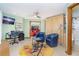 Bonus room offering access to the bathroom, beautiful lighting, stylish decor, and a comfortable workspace at 471 Capri Isles Ct, Punta Gorda, FL 33950