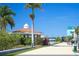 Beautiful community featuring a gazebo and lush landscaping in a tropical environment on a sunny day at 471 Capri Isles Ct, Punta Gorda, FL 33950