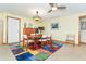 Cozy dining room featuring a wood table, chairs, and an eye-catching colorful rug at 471 Capri Isles Ct, Punta Gorda, FL 33950