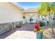 Welcoming entrance featuring a stone accent wall, potted plants, and a double door entry at 471 Capri Isles Ct, Punta Gorda, FL 33950
