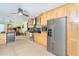 Modern kitchen featuring stainless steel appliances, custom cabinetry, and an open layout at 471 Capri Isles Ct, Punta Gorda, FL 33950