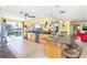 Spacious kitchen with granite countertops, stainless steel appliances, and an island bar with seating at 471 Capri Isles Ct, Punta Gorda, FL 33950
