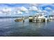 Picturesque marina scene featuring yachts, boats, and tranquil waterfront views under a partly cloudy sky at 471 Capri Isles Ct, Punta Gorda, FL 33950