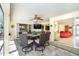 Covered lanai featuring a dining table, ceiling fan and access to the main house at 471 Capri Isles Ct, Punta Gorda, FL 33950
