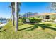 Screened in pool area with lush greenery creating a private backyard at 471 Capri Isles Ct, Punta Gorda, FL 33950