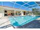 Relaxing enclosed pool features a cool deck, clear blue water, and an open-air layout at 471 Capri Isles Ct, Punta Gorda, FL 33950