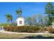 Statue of a conquistador atop a monument surrounded by colorful flowers and palm trees under a clear blue sky at 471 Capri Isles Ct, Punta Gorda, FL 33950