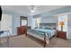 Bedroom featuring a queen-sized bed, carpeted flooring, and ample natural light at 5 Pine Valley Rd, Rotonda West, FL 33947
