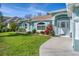 Beautiful home with well-maintained lawn and landscaping at 5 Pine Valley Rd, Rotonda West, FL 33947