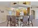 Kitchen with counter seating, pendant lighting, and ceiling fan at 5 Pine Valley Rd, Rotonda West, FL 33947