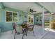 Covered patio with a dining table, ceiling fan, and view of the backyard, perfect for outdoor dining and entertaining at 5 Pine Valley Rd, Rotonda West, FL 33947