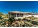 Backyard featuring a patio and screened lanai perfect for outdoor living and entertaining at 51 Mark Twain Ln, Rotonda West, FL 33947