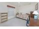 Bedroom with a ceiling fan and a window with blind coverings at 51 Mark Twain Ln, Rotonda West, FL 33947