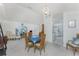 Open-concept living and dining space with plenty of natural light and neutral tones at 51 Mark Twain Ln, Rotonda West, FL 33947