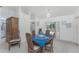 Dining room area with a chandelier, seating for four, and sliding glass doors to the outdoors at 51 Mark Twain Ln, Rotonda West, FL 33947