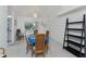 Bright dining area with a wooden table set for four and sliding doors leading to the patio at 51 Mark Twain Ln, Rotonda West, FL 33947