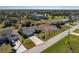 The home boasts a well-maintained lawn, an extended driveway, and is adjacent to a vacant lot at 51 Mark Twain Ln, Rotonda West, FL 33947