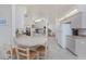 Open-concept kitchen area with counter seating and easy access to the dining and living areas at 51 Mark Twain Ln, Rotonda West, FL 33947