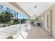 Enclosed lanai featuring an outdoor living space with comfortable seating and a view of the backyard at 51 Mark Twain Ln, Rotonda West, FL 33947