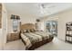 Spacious bedroom with a ceiling fan, sliders to the lanai, and carpet flooring at 5258 Grassland Ter, Port Charlotte, FL 33981