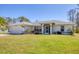 A well-maintained home with a manicured lawn and attractive landscaping creating curb appeal at 5258 Grassland Ter, Port Charlotte, FL 33981