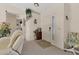 A welcoming foyer with neutral tones, carpet flooring, and a view to the main living area at 5258 Grassland Ter, Port Charlotte, FL 33981