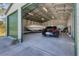 Interior of a detached garage featuring a boat and car, offering plenty of storage space at 5258 Grassland Ter, Port Charlotte, FL 33981