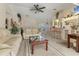 Inviting living room features neutral decor, plush seating, and a ceiling fan for comfortable living at 5258 Grassland Ter, Port Charlotte, FL 33981