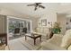 Inviting living room with a view to the pool area, offering a seamless indoor-outdoor living experience at 5258 Grassland Ter, Port Charlotte, FL 33981