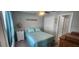 Comfortable bedroom with blue accents, a ceiling fan, and a well-lit ambiance at 5388 Montego Ln, Port Charlotte, FL 33981