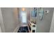 Inviting entryway with light gray walls, tile flooring, and stylish decor creating a welcoming ambiance at 5388 Montego Ln, Port Charlotte, FL 33981