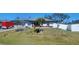 Charming single-story home featuring a well-maintained front yard and a white fence at 5388 Montego Ln, Port Charlotte, FL 33981