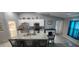 Well-equipped kitchen with a large island, stainless appliances, and ample counter space at 5388 Montego Ln, Port Charlotte, FL 33981