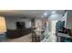 Wide view of living room and kitchen with stainless steel appliances and granite countertops at 5388 Montego Ln, Port Charlotte, FL 33981