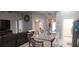 Open floor plan with kitchen island, sleek countertops, and view into the living room at 5388 Montego Ln, Port Charlotte, FL 33981