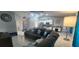 Spacious living room with tile floors, comfy furniture, open kitchen, and elegant decor at 5388 Montego Ln, Port Charlotte, FL 33981