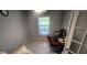 Home office featuring wood floors, desk and chair, and natural light from the backyard at 5388 Montego Ln, Port Charlotte, FL 33981