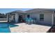 This outdoor patio offers outdoor seating with a pool view, great for entertaining or relaxation at 5388 Montego Ln, Port Charlotte, FL 33981