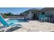 The backyard has a refreshing pool, deck seating, and a covered patio for relaxation and entertainment at 5388 Montego Ln, Port Charlotte, FL 33981