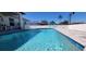 This inviting pool offers a cool escape, complete with a sun lounger for poolside relaxation at 5388 Montego Ln, Port Charlotte, FL 33981