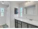 Elegant bathroom featuring a modern vanity with gray cabinets and a glimpse into the shower area at 5619 Bayshore Rd # 240, Palmetto, FL 34221