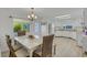 Bright dining area adjacent to kitchen with a view of the outdoor landscaping through large windows at 5619 Bayshore Rd # 240, Palmetto, FL 34221