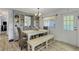 Elegant dining area featuring a stylish table with wicker chairs and charming decor at 5619 Bayshore Rd # 240, Palmetto, FL 34221